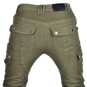 Detail of olive green motorcycle jeans with accordion stretch panels and cargo pockets