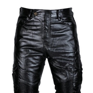 Detail of waterproof motorcycle leather pants with knee accordion stretch panels