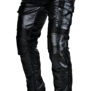 Detail of waterproof leather motorcycle pants featuring knee pleats and cargo pockets