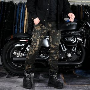 Detail of camouflage motorcycle cargo pants with large side flap pockets and sturdy fabric