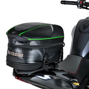Detail of waterproof motorcycle tail bag with carbon fiber texture and green piping finish
