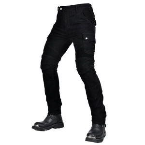 Detail view of black biker jeans showing elastic accordion panels on knees and cargo pockets