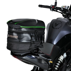 Waterproof motorcycle tail bag with carbon fiber texture and green trim installed on seat
