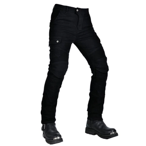Detail view of black motorcycle jeans with pleated knees and tactical cargo pockets