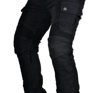 Detail of black motorcycle cargo pants showing ribbed knee panels and metal buckle pocket