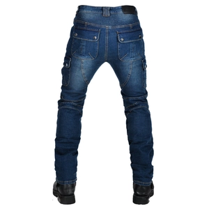 Macro view of blue biker jeans with protective accordion stretch panels and leather patch
