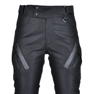 Detail view of black motorcycle pants with waterproof zipper pockets and waist D-ring buckle