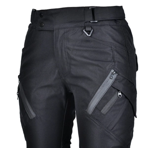 Detail of high-waist motorcycle pants with double metal buttons and D-ring attachment
