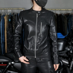 Detail of a black women's biker jacket with a stand collar and metallic chest zipper