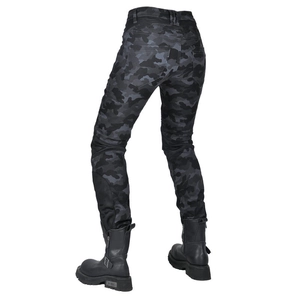 Detail of slim-fit camouflage biker pants with elastic waist pleats and moto boots