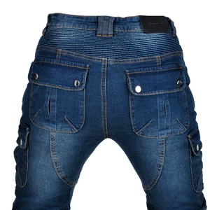 Detail of blue biker jeans featuring elastic waist panels and large cargo pockets