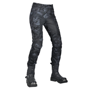 Detail of camo motorcycle pants with accordion knee panels and metal toe boots