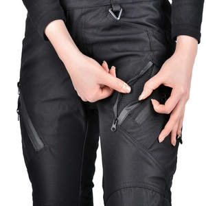Detail view of breathable mesh lining and high-quality zippers on black motorcycle pants