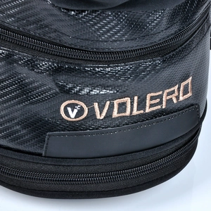 Detailed macro view of the carbon fiber texture and embroidered logo on this motorcycle bag