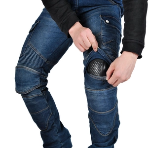 Detail of knee accordion stretch panels and removable honeycomb armor on biker jeans