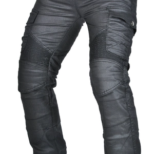 Macro shot of motorcycle pants with pleated knee panels and cargo pockets in black