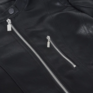 Detail of black motorcycle jacket featuring stand collar with metal snap and silver zippers