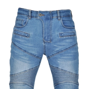 Detailed macro view of light blue washed denim with biker ribbed pleated motorcycle knee panels