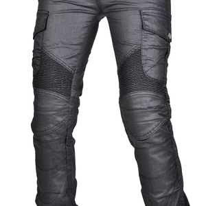 Detail of wax-coated motorcycle riding pants with stretch panels and cargo pockets