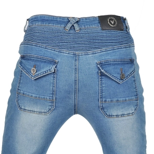 Detail view of denim motorcycle pants with elastic waist panels and snap button flap pockets