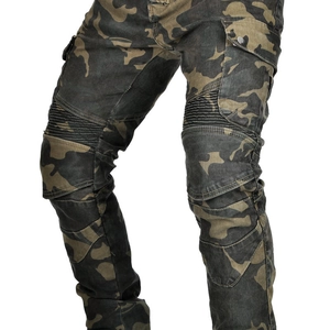 Detail of green jungle camo motorcycle pants featuring pleated knee panels and cargo pockets