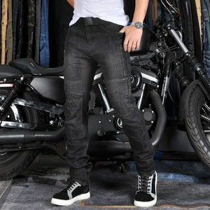 Detail view of motorcycle jeans with accordion panels at the knees for flexible riding
