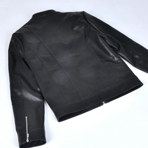 Back view of a black motorcycle jacket with vertical seam details and a stand collar