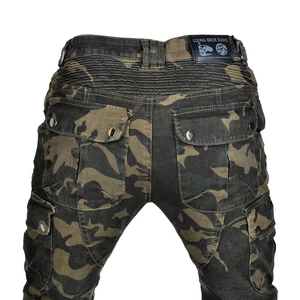 Detail of camouflage motorcycle pants featuring elasticated waist and leather brand tag