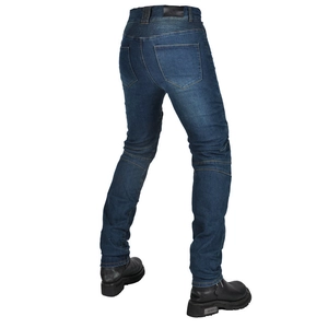 Rear view of blue motorcycle riding jeans with accordion stretch panels and leather boots