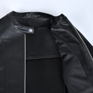 Detail view of motorcycle leather jacket featuring metal zipper and breathable mesh lining