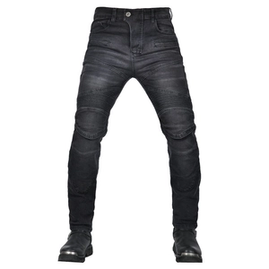 Detailed view of motorcycle jeans featuring ribbed panels on knees and washed black denim