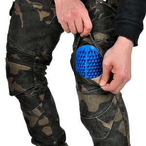 Detail of camo motorcycle jeans with blue honeycomb knee armor and accordion panels