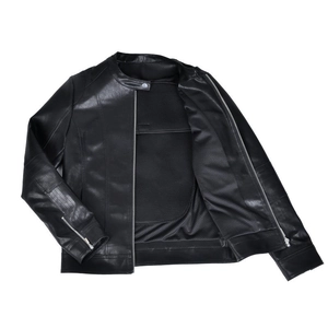 Close-up of black leather motorcycle jacket featuring mesh lining and zipped cuffs
