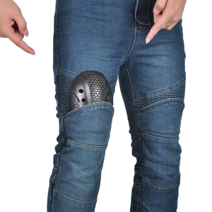 Detail of blue motorcycle jeans featuring flexible accordion panels and protective knee pads