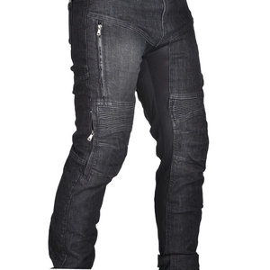 Detail of motorcycle jeans with accordion stretch panels on knees and zip pockets