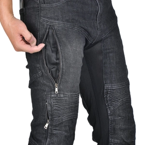 Close-up of motorcycle jeans featuring mesh lining, zipper pocket and elastic knee panels