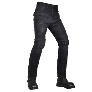 Close-up of motorcycle jeans with accordion stretch panels and reinforced stitching details