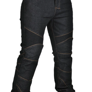 Detail of dark blue motorcycle jeans with orange contrast stitching and pleated knee panels