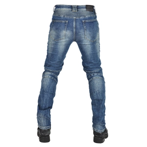 Detail of accordion stretch panels on the back waist and knees of blue motorcycle jeans