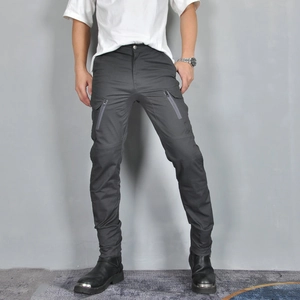 Detail of slim-fit motorcycle cargo pants showing waterproof zipper pockets and tactical design