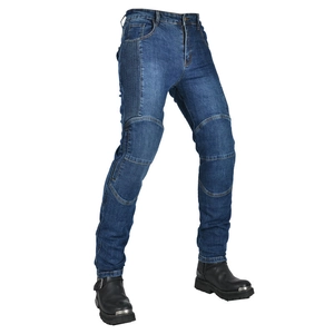 Detail view of motorcycle jeans featuring stretch panels and durable blue denim fabric