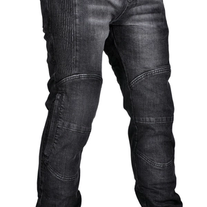 Detailed macro view of motorcycle jeans with accordion panels and reinforced knee protection