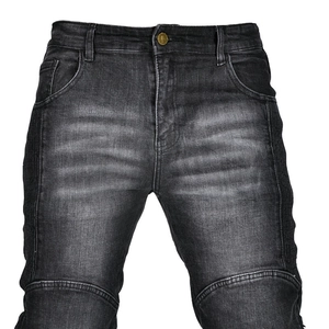 Detail of motorcycle jeans featuring organ pleats and reinforced knee stitching for riding