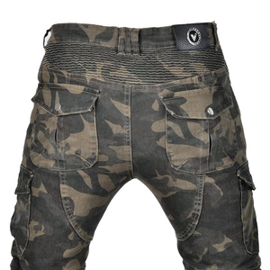 Close-up of camouflage motorcycle pants featuring elastic stretch panels and cargo pockets