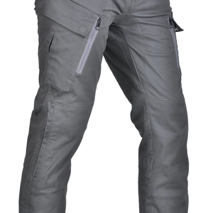 Detail of dark grey motorcycle cargo pants showing reinforced knees and zipper pockets