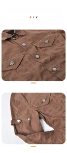 Detail of wear-resistant oilcloth jacket featuring metal snap buttons and sleeve adjustment