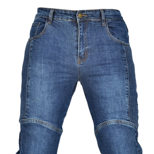 Detailed view of blue washed motorcycle biker jeans with pleated accordion stretch panels