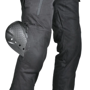 Detail of grey tactical motorcycle pants featuring protective knee pads and cargo pocket