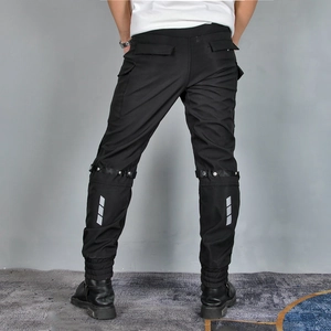 Rear view of black motorcycle pants with silver reflective stripes and adjustable straps