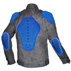 Macro view of blue honeycomb protective pads on a vintage waxed motorcycle riding jacket